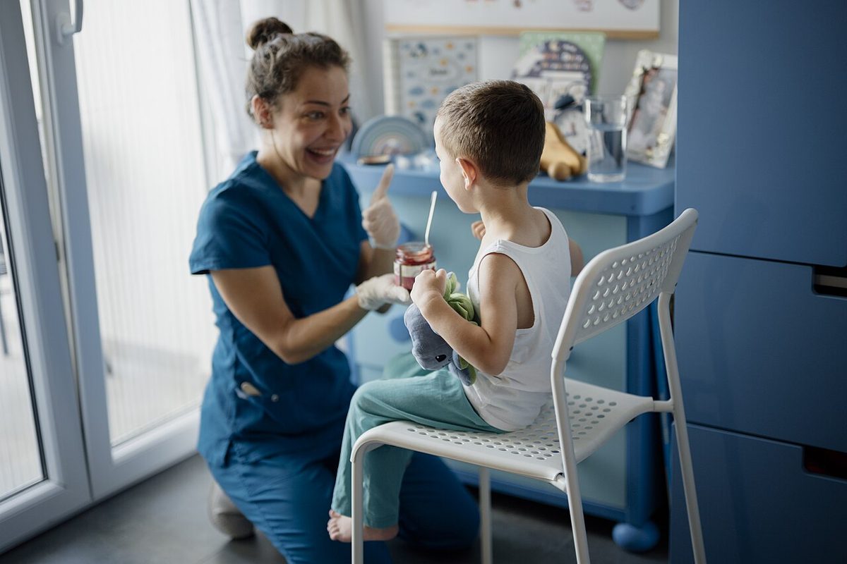 A dentist treating a child in a dental clinic